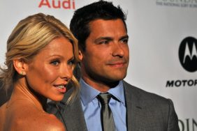 Kelly Ripa Mark Consuelos suit tie necklace earrings upswept hair